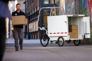 E-Cargobike von Coaster Cycles für die Zustellung von Paketen